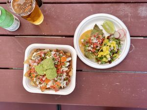 Our first time here! Nachos with broads jackfruit + nopales taco + al pastor taco— all so good! at La Taquiza Vegana in Portland