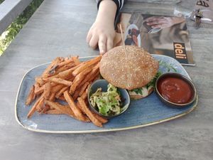 Delicious vegan burger ordered with extra sweet potato fries, so yummy! at Deli in Wagna