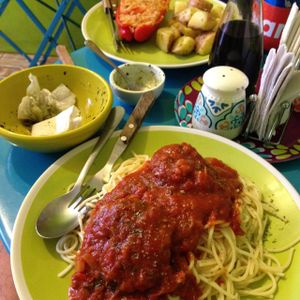 Risotto stuffed red pepper with potatoes and spaghetti with 'meatballs' (home made soya patties) at Estrella Negra in San Pedro De Atacama