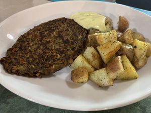 Black bean burger with potatoes  at Estrella Negra in San Pedro De Atacama