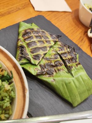 Their top rated dish - some kind of smoky seitan with herbs cooked in this leaf at Vegegood 素来很好 in Shanghai