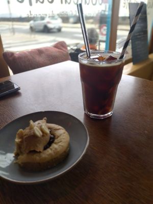Vegan peanut butter and chocolate cookie, and iced black coffee at Couleur Café in Saint-malo