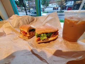 Sipping an iced oat milk latte by the big window. at The Wedge Community Food Co-op in Minneapolis