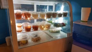 Salads and mezze display at C'est Bon Salades Maison in Marseille