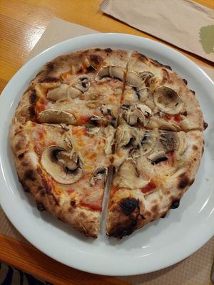 Pizza Margherita with mushrooms and vegan cheese at Porto Rino in Crete