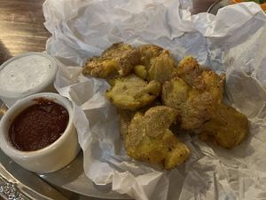 TREE FROG'S SMASHED YUKON GOLD POTATOES, SMOKED SEA SALT, OLIVE OIL, HOUSE HARISSA KETCHUP, ZHUG SPICE MIX, FORAGER VEGAN SOUR CREAM, CHIVES  at Sonoma Wine Shop - La Bodega in Sebastopol