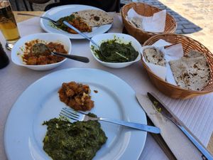 Cauliflower & potatoes with Spinach and potatoes,  roti and chapati bread at Dawat in Tavira