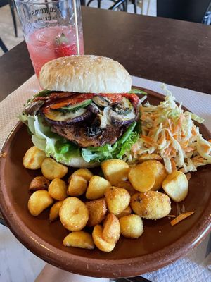 Burger with fries and coleslaw   at The World Family in Finisterre