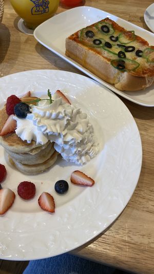 Pancakes with fruit and pizza toast   at KOMEDA is in Tokyo