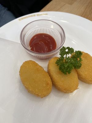 Croquettes with ketchup on the side   at KOMEDA is in Tokyo