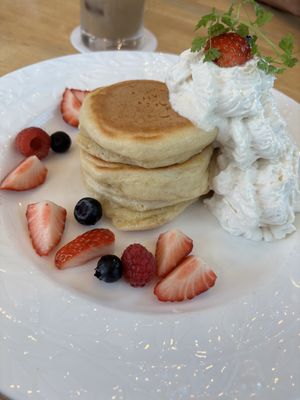 Pancakes with berries and whipped cream   at KOMEDA is in Tokyo