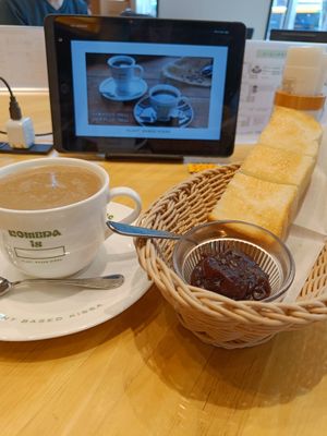 Coffee with "milk", toast with adzuki jam and above the tablet through which you order. at KOMEDA is in Tokyo