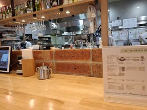 Tables facing the kitchen at KOMEDA is in Tokyo