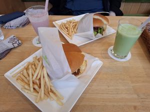 Chicken tartar burger and curry mayo burger were AMAZING.  With two really yummy smoothies. at KOMEDA is in Tokyo