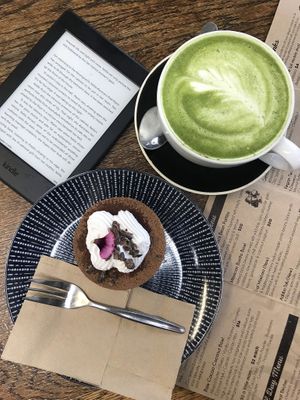 Matcha green latte and delicious cake at Wise Cicada Wholefood Cafe in Auckland