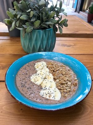 Hazelnut milk bowl with cacao, dates, homemade peanut butter, banana, granola and chia seeds at Cafe Noti in Mallorca