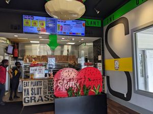 Menu over order counter at Slutty Vegan in Jonesboro