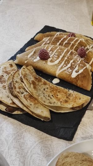 Desayuno. Crepes dulces y tortillas saladas. at Molino del Corregidor in San Roman De Cameros