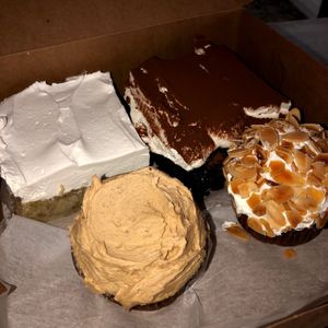 Banana cake - chocolate cream cake - chocolate peanut butter cupcake - almond cupcake  at D&D Bake Shoppe in Copiague