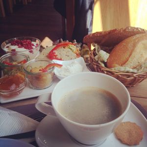 vegan breakfast platter: 5 different breads, two spreads, margarine, marmalade, soy yogurt with pomegranate, apples and some sort of citrus, chopped veggies and vegan sliced bratwurst at Köhlers - Karmelitenstr in Wurzburg