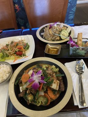 Hug Rama with mock duck, spring rolls, pineapple rice with tofu, and papaya salad  at Hug Thai Cuisine in Bellmore