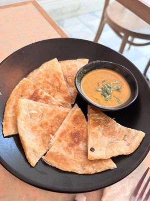 Brunch menu: Roti with onion curry  at Monarch in Brooklyn