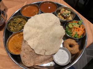 Vegan Meals (from the left, Veggie curry, Broccoli mash, Sambor, Lasam, Chick pea salad, Green salad, Vada with Coconut Chutney, Papadom over Basmati Rice and Chpati) at Erick South in Tokyo