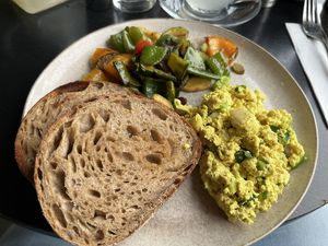 Scrambled tofu with grilled vegetables and sourdough bread  at KLYO in Vienna