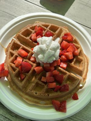 Waffle w/strawberries, caramel sauce, whipped cream  at Sweet Izzy in Harwich Port