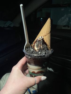 Chocolate and vanilla soft serve twist with “Oreo”s, hot fudge, and a waffle cone. Yummmm  at Sweet Izzy in Harwich Port