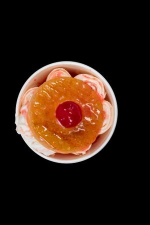 Vegan Madagascar vanilla ice cream with pineapples and cherries topped with a cinnamon brûlée pineapple and vegan whipped cream.  at Where's The Scoop? in Alpharetta