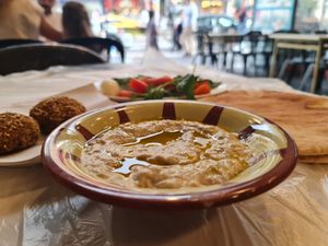 Mutabal, stuffed falafel, and the complimentary mint/tomatoes/pickles/onion. at Hashem in Amman