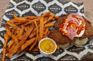 Buffalo Ranch Burger (vegan) with the bread-bun swapped for pineapple rings, and the blue-cheese sauce swapped for Jack Daniels mustard sauce, with sweet potato fries at Annie's Burger Shack in Nottingham