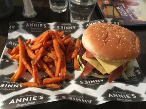 The Reggie - vegan version: brioche bun, vegan bacon, vegan cheese, vegan mayo, hashbrown, lettuce with sweet potato fries at Annie's Burger Shack in Nottingham