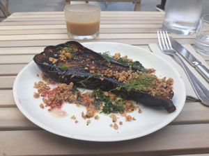 Sage-smoked aubergine with salsa verde, coconut crumble & hibiscus at Chéri Coco in Pantin