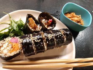 Main: Tofu Teriyaki Roll and vegan kimchi at Mama Uma in Madrid