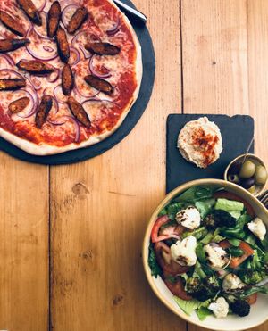 Chorizo (vg) pizza and fresh salad at The Sound Lounge in Sutton