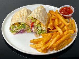 garlic tofu wrap w/dreamy tahini + fries w/spicy chili (cut in half + plated at home) at Doner Box in Seattle