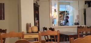 Chef preparing my burger at Phoenix Belgian Vegg in Malaga