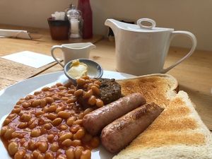 The small vegan breakfast, delicious haggis and juicy sausages. £5.50 👍 at The Midge Bite Cafe in Achnasheen