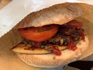 Breakfast to go- tattie  scone, fried tomatoes and vegan Haggis in a roll with a dash of Heinz tomato ketchup 😋  at The Midge Bite Cafe in Achnasheen