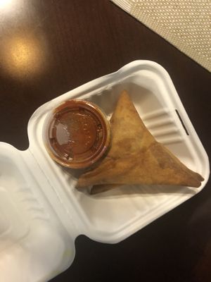 Samosa and spicy sauce. They went well together.  at Tigi's in Stone Mountain