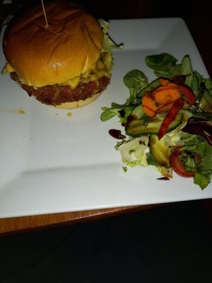 Spicy vegan burger with salad! at Cafe Under the Spire in Gateshead
