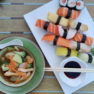 Dumpling soup starter with mixed sushi  at Tau in Vienna