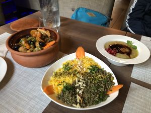 Tajin , baba ghanoush, and a dish of rice, wheat, nuts and spices at Forever in Malmo