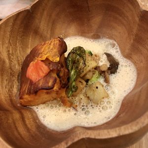 Winter squash in cedar sauce of seeds and spice bush berries   at Oyster Oyster in Washington