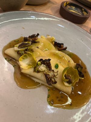 Stuffed rutabaga with parsnip, truffle, brussel sprouts, brown butter jus.  at Oyster Oyster in Washington