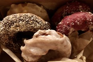 Vegan doughnuts: orange creamcicle, blueberry cream cheeze, chocolate coconut, and vanilla something. All insane. at Babes in Sacramento