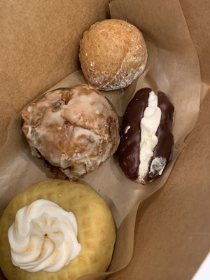 From bottom: lemon meringue, apple fritter, eclair, Nutella donut hole.   at Babes in Sacramento