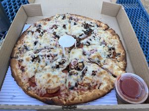 Vegan 12" pizza with dairy free cheese, plant-based meat and GF/vegan dough.   at Monroe Pizza & Pints in Monroe